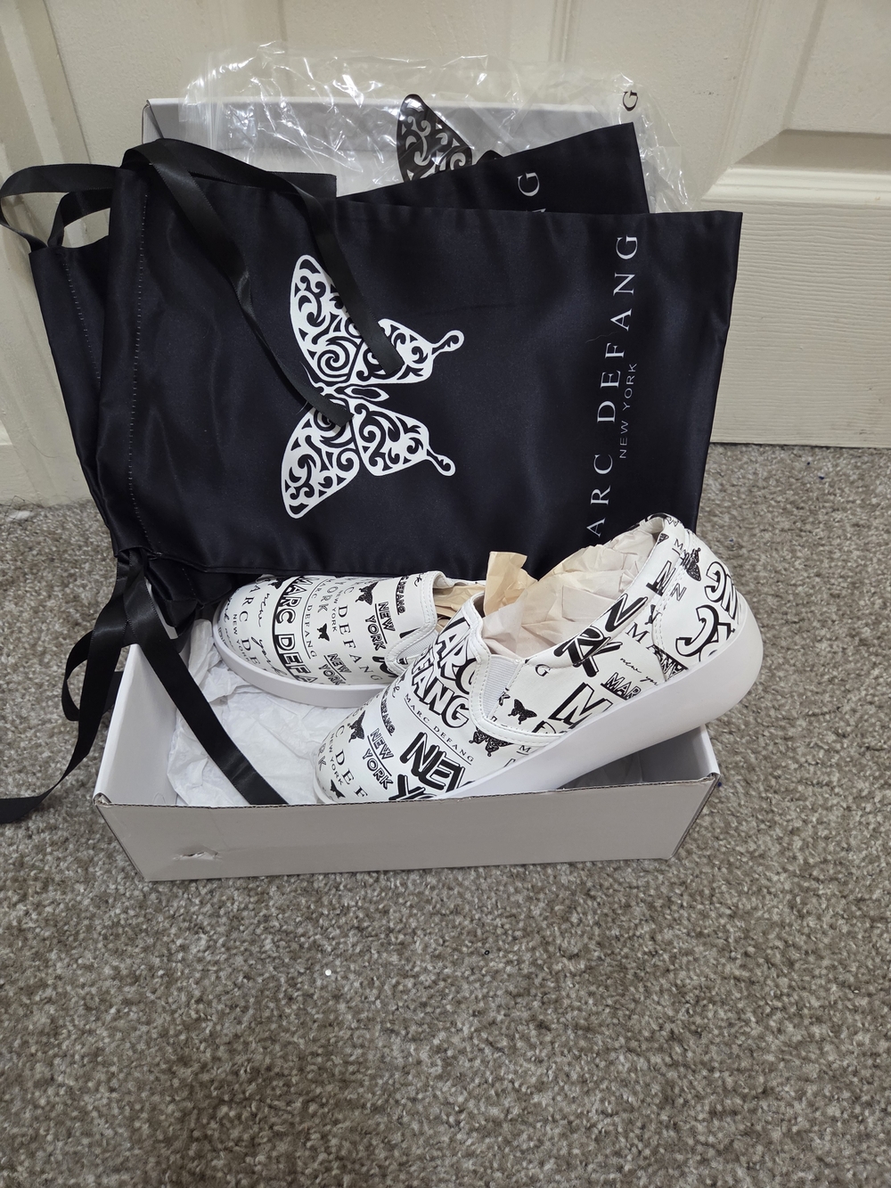 Marc Defang White Slip-On Sneakers with Black Graphic Print